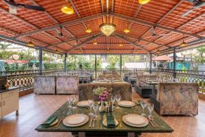 a dining room with a table and chairs at Mountview Resort in Lonavala
