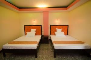 Postel nebo postele na pokoji v ubytování RSG Microhotel