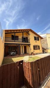a house with a fence in front of it at Gredos Tiétar in El Arenal