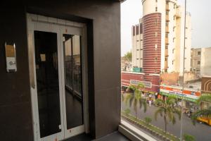 a window in a building with a view of a city at Hotel Vdara Bliss in Vijayawāda