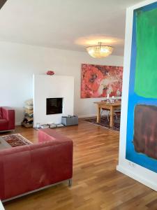 a living room with a couch and a table at Boutique Villa Maria Plain in Radeck