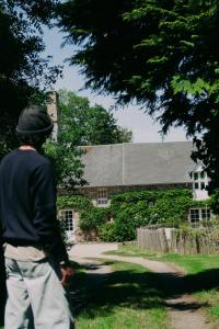 a man standing in front of a building at Maison Hyacinthe in Saint-Pierre-Langers +75 photos