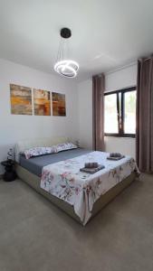 a bedroom with a large bed in a room at 5 srca in Stanići