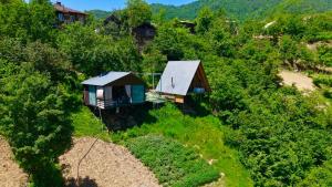 an overhead view of two small houses on a hill at Sunrise house merisi in Merisi
