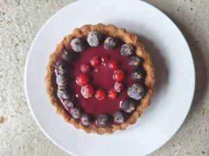 a blueberry pie on a plate on a table at Lou Montadou in Yssingeaux