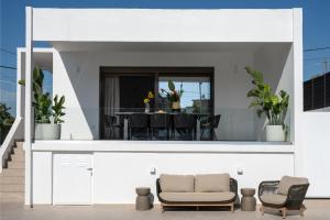 a view of the living room and dining room of a house at Kaerati Athens in Vari