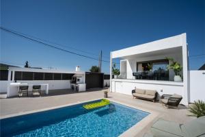 a backyard with a swimming pool and a house at Kaerati Athens in Vari
