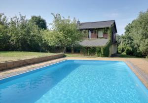 an image of a swimming pool in front of a house at Chata Pod Hájkem in Vrchlabí