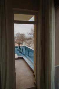 a view of a swimming pool through a window at Dolphins Otel in Akçakoca