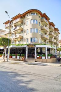 a large building on the side of a street at Sunway Apart Hotel in Alanya