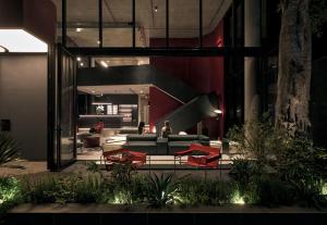 a lobby of a building with a couch and chairs at Mevan Hotel Dalat in Da Lat
