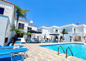 a resort with a swimming pool in front of a building at Florence Hotel Apartments in Ayia Napa