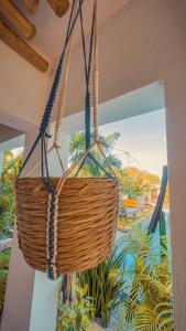 a wicker basket hanging from a ceiling at VILLA Fleurie in Mafia
