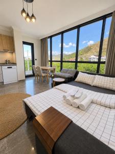 a bedroom with a large bed with towels on it at Mirşah Suit in Dalaman