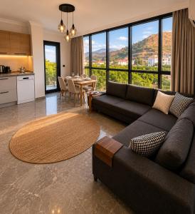 a living room with a couch and a table at Mirşah Suit in Dalaman