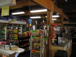 a store filled with lots of different types of food at Ponderosa Camping Resort One-Bedroom Cabin 2 in Lotus