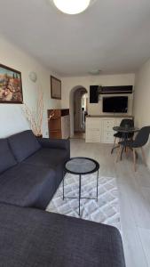 a living room with a couch and a table at Villa Detelina Balchik in Balchik