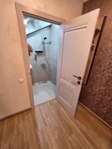 a bathroom with a shower and a door at Merien hotel in Yerevan +37 photos