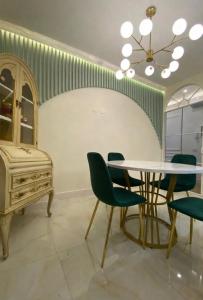 a dining room with a table and chairs and a piano at Gaglian's Suites Lake Como in Como +24 photos