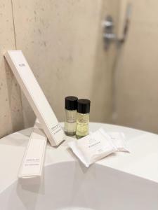 two products sitting on a counter in a bathroom at Gysi`s Hotel & Restaurant - Near Tirana in Tapizë +34 photos