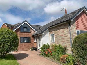 a brick house with a brick driveway at The Hideaway-Sharples-Bolton in Bolton