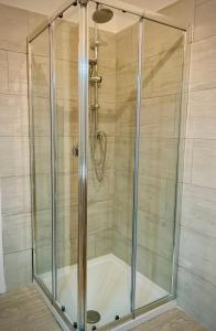 a shower with a glass enclosure in a bathroom at Ca dei Cappuccina in Mestre