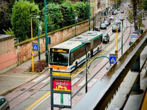 a bus is driving down a city street at Ca dei Cappuccina in Mestre +15 photos