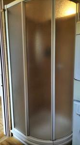 a stainless steel refrigerator in a kitchen at Il Nido di Concesio in Concesio +8 photos