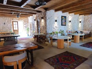 a room with tables and chairs in a building at Cappadocia Alfa Cave Hotel in Ürgüp