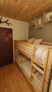 a bedroom with two bunk beds in a cabin at Solarium Mountain Studio 4 People Les Angles in Les Angles