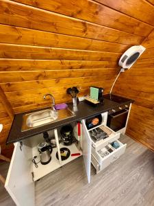 a small kitchen with a counter and a sink at Bungalow de Quintas in Marco de Canaveses