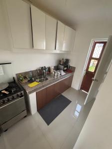 an overhead view of a kitchen with a sink and a stove at Arellano Residence in Batangas City