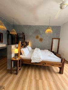 a bedroom with a large bed with white sheets at NoyaAfrika Kendwa Boutique in Kendwa +57 photos