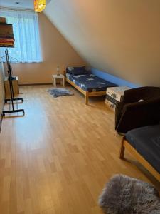 a living room with a bed and a couch at Gorczyca Reset in Płaska