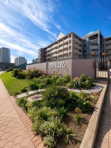 a building with a sign that reads de wall at Diaz De Valle 35 in Mossel Bay