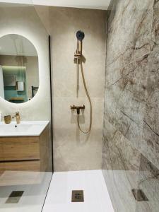 a bathroom with a shower and a sink at Monaco - Menton Old Town - Climatisation - Seaview - Luxury rénovation in Menton +45 photos