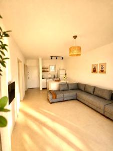 a living room with a couch and a table at Gammi Hayıtbükü in Datca