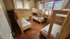 a group of bunk beds in a room at El Bosque de la Herrezuela in Guisando