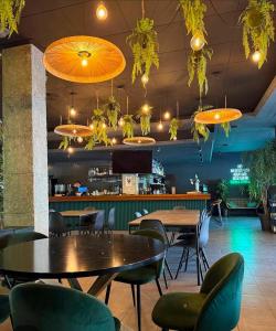 a restaurant with tables and chairs and a bar at Apartamento en Mar Blau Calella in Calella