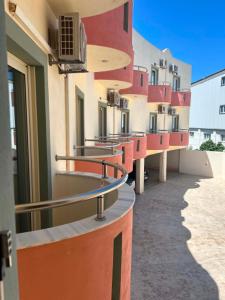 a row of buildings on a street at Ostria Hotel in Palekastron