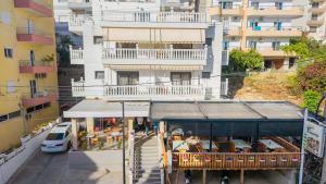an overhead view of a building with tables and chairs at Hotel Primavera in Sarandë