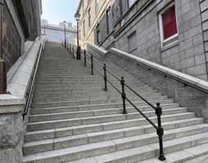 a set of stairs next to a building at Super Nova Self-Service Hotel in Aberdeen