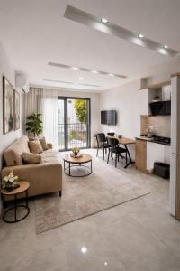 a living room with a couch and a table at AC Konaklama in Kuşadası