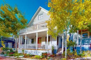 a white house with trees in front of it at Telluride Memories in Telluride