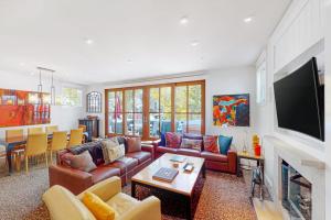 a living room with leather couches and a fireplace at Telluride Memories in Telluride