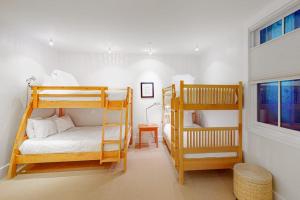 a bedroom with two bunk beds and a window at Telluride Memories in Telluride