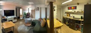 a living room with a kitchen and a dining room at Renthouse Rest & Go Paide in Paide +4 photos