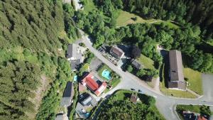 an overhead view of a road with cars and houses at hotel spiegeltaler eck in Wildemann