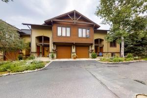 a wooden house with a driveway in front of it at Waterstone 2748 in Steamboat Springs