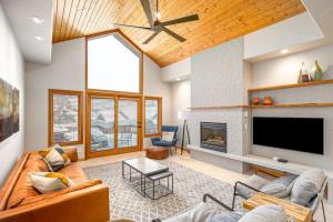 a living room with a couch and a fireplace at Evergreens 12 in Steamboat Springs